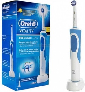 Электрическую зубную щетку oral-b