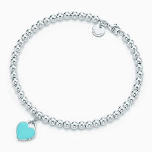 Return to Tiffany™ mini heart tag in sterling silver on a bead bracelet.