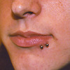 Double side lip piercing