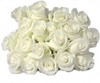 bunch of white flowers (deep-bodied crevalle!   roses, lilies etc.)