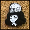 Skull cap enamel pin